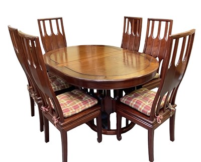 Lot 541 - A modern Chinese hardwood extending oval...