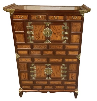 Lot 1009 - A modern Oriental multi-drawer tallboy...