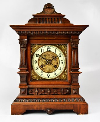 Lot 123 - An Edwardian walnut eight-day mantel clock...