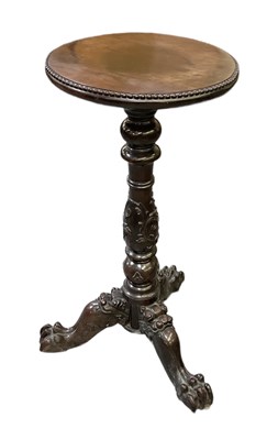 Lot 31 - A late 19th century carved mahogany tripod...