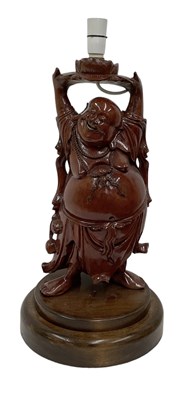 Lot 1098 - A Chinese carved hardwood figural table lamp...