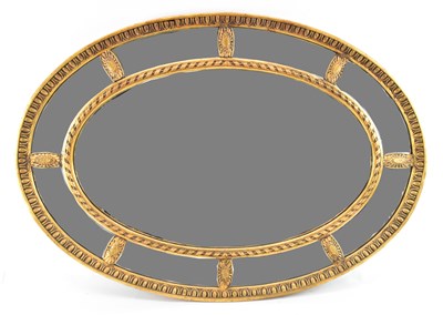 Lot 62 - A reproduction gilt framed oval wall mirror,...