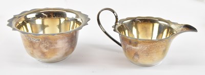 Lot 1166 - A George V hallmarked silver milk jug and...