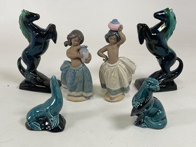 Lot 241 - A group of ceramic figures, comprising a Poole...