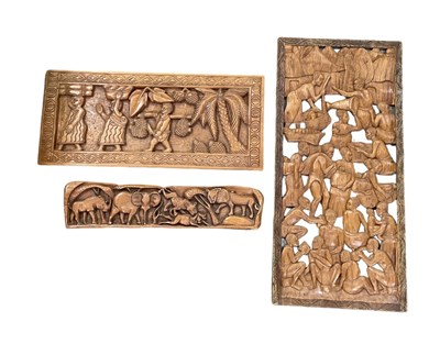 Lot 1103 - A large African carved wooden wall hanging...