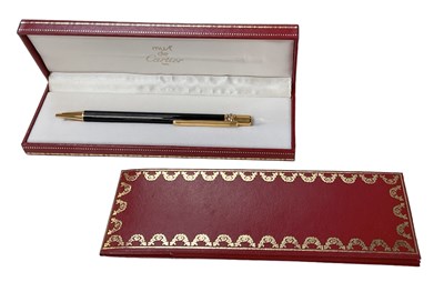 Lot 336 - MUST DE CARTIER; a cased vintage ballpoint pen.