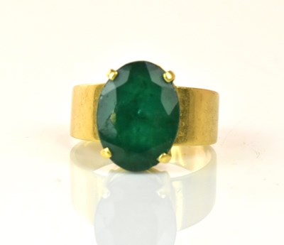 Lot 1201 - An 18ct yellow gold and Colombian emerald ring,...