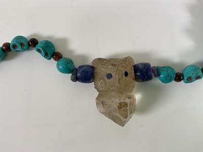 Lot 1204 - Two similar South American skull carved...
