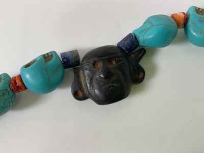 Lot 1204 - Two similar South American skull carved...