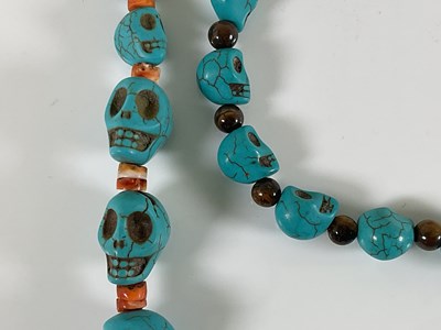 Lot 1204 - Two similar South American skull carved...