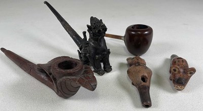 Lot 1042 - A polished pipe with simple mouthpiece, two...