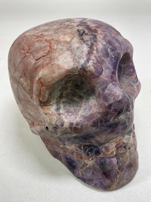 Lot 1035 - A South American carved veined purple stone...