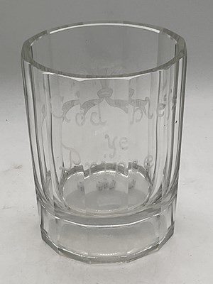 Lot 255 - A glass beaker set with three dice to the base...