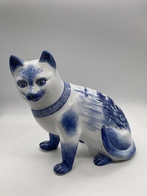 Lot 161 - An unusual porcelain model of a seated cat,...