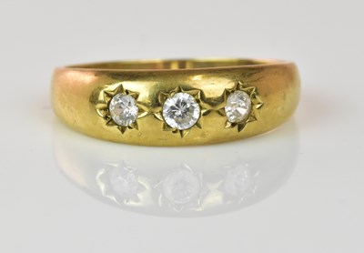 Lot 1062 - A 9ct yellow gold three stone gentleman's ring,...