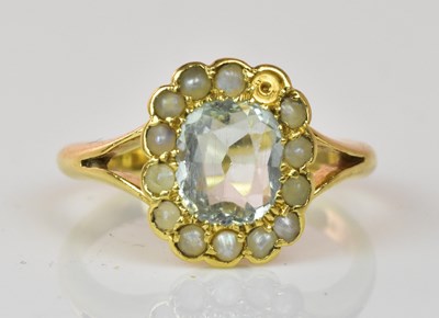 Lot 1063 - An 18ct yellow gold seed pearl and pale blue...