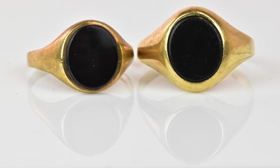 Lot 1066 - Two 9ct yellow gold onyx set signet rings,...