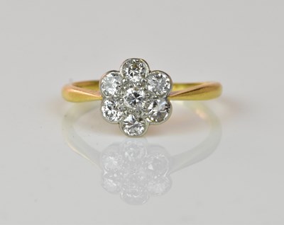 Lot 1067 - An 18ct yellow gold diamond set flower head...