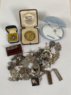 Lot 1071 - A group of silver and white metal costume...