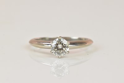 Lot 1055 - TIFFANY & CO; a platinum and diamond solitaire...