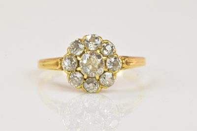 Lot 1056 - A circa 1900 yellow metal diamond flower head...