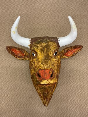 Lot 77 - A large wall mounted decorative bull's head,...