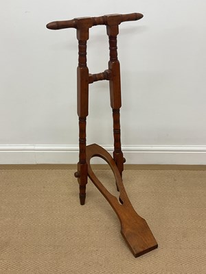 Lot 80 - An Edwardian wooden boot jack, height 86cm.