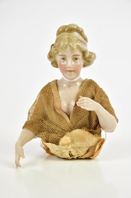 Lot 805 - A late 19th century porcelain half doll,...