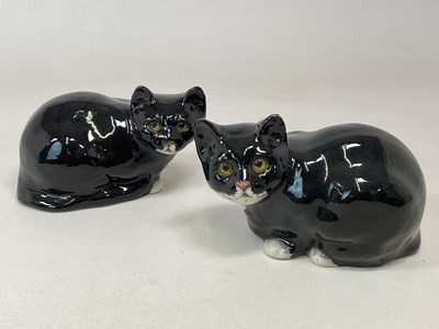 Lot 202 - WINSTANLEY POTTERY; a pair of seated black and...