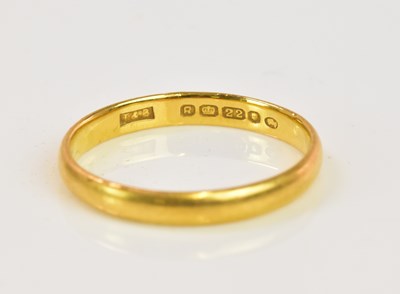 Lot 1217 - A 22ct yellow gold wedding band, size P,...