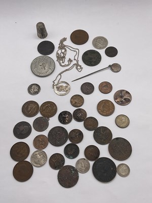 Lot 1411 - A small group of coins, a silver thimble and a...