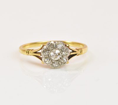 Lot 1219 - An 18ct yellow gold and diamond seven stone...