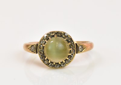 Lot 1220 - A yellow metal moonstone and diamond ring, the...