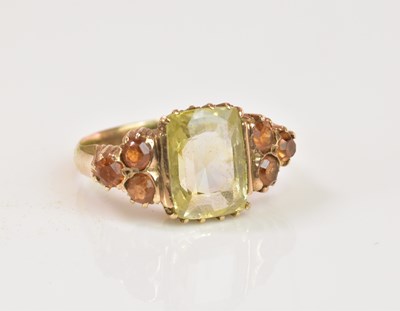 Lot 1222 - A yellow metal dress ring with pale green...