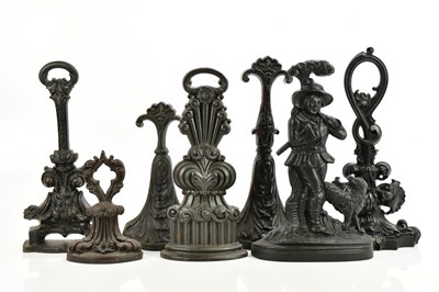 Lot 562 - Seven Victorian and later cast iron doorstops,...