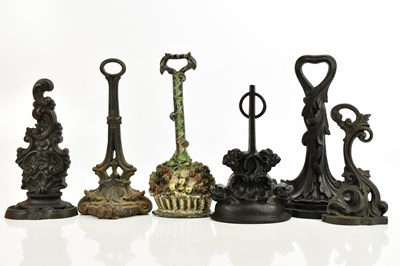 Lot 534 - Six Victorian and later cast iron doorstops,...