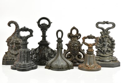 Lot 541 - Seven Victorian and later cast iron doorstops...