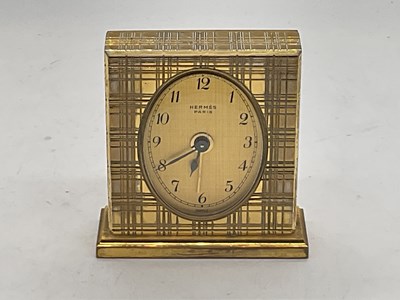 Lot 1332 - HERMÈS; a vintage cased lacquered brass...