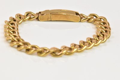 Lot 1210 - A heavy 9ct yellow gold curb link bracelet,...