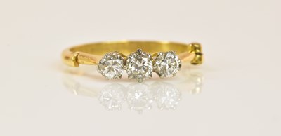 Lot 581 - An unusual 18ct yellow gold diamond three...