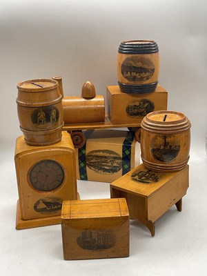 Lot 19 - MAUCHLINE WARE; eight money boxes, the largest...