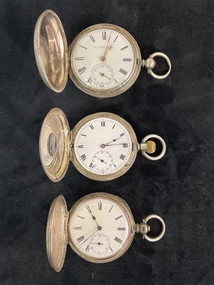 Lot 1344 - Two silver key wind full hunter pocket watches,...