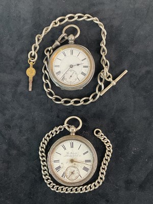 Lot 1357 - Two silver key wind open face pocket watches,...