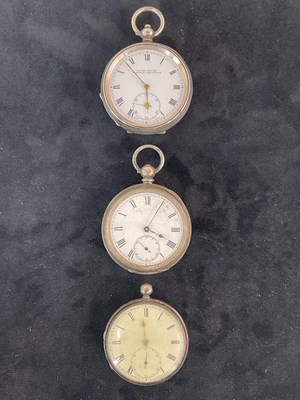 Lot 1355 - Three silver key wind open face pocket watches,...