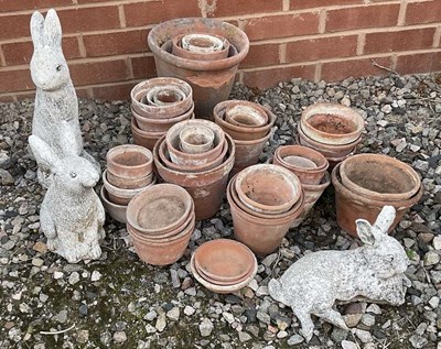 Lot 748 - A quantity of terracotta pots in various sizes,...