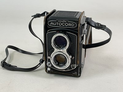 Lot 323 - MINOLTA; a leather cased Autocord camera.