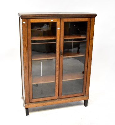 Lot 16 - An early 20th century oak twin glazed door bookcase