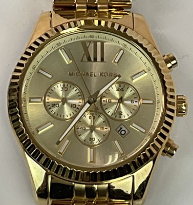 Lot 1381 - MICHAEL KORS; a gentleman's gold tone...