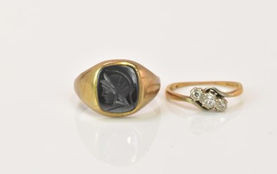 Lot 1234 - A 9ct gold signet ring with engraved hardstone...