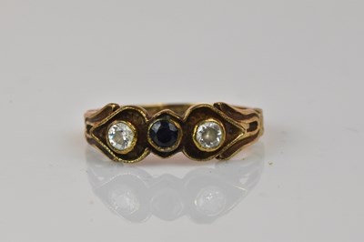 Lot 1059 - A 9ct yellow gold three stone dress ring,...